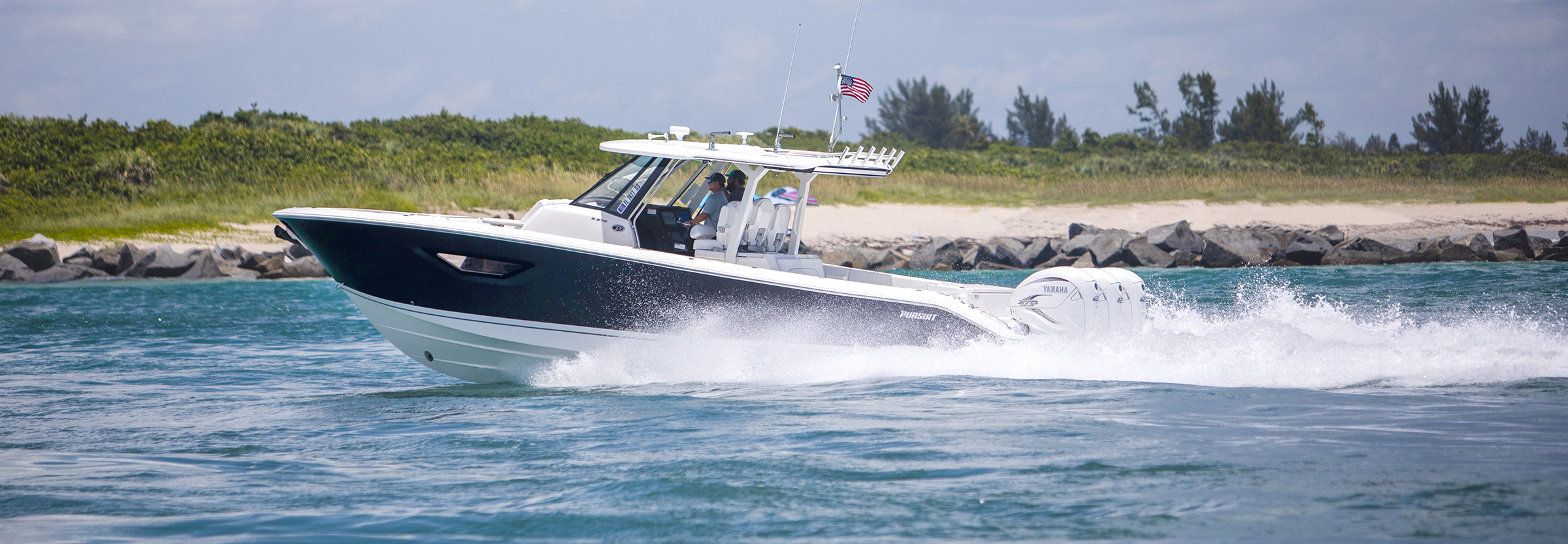 Pursuit S378 center console with triple Yamaha outboards